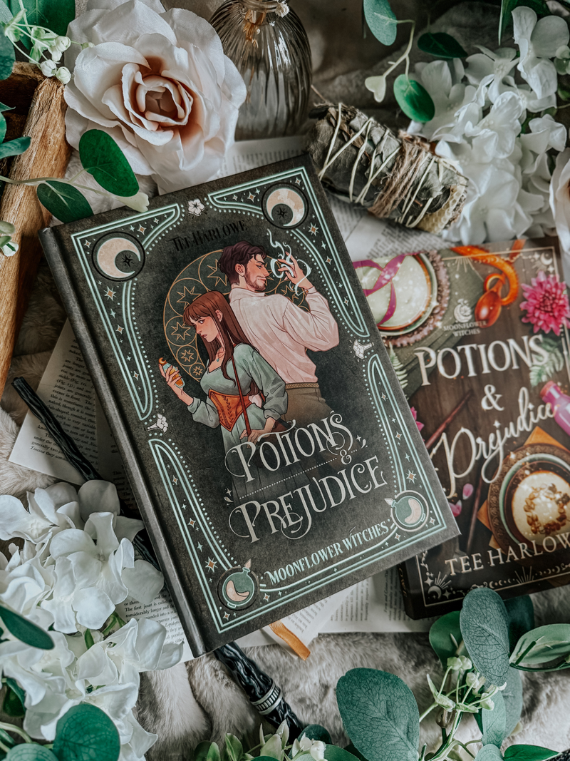 Book titled 'Potions & Prejudice' surrounded by flowers and greenery on a textured surface.